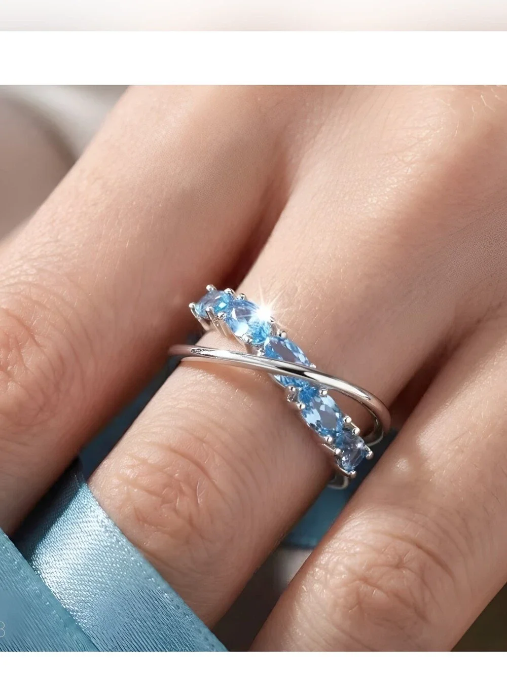 'Criss Cross' simulated Aquamarine ring in Stainless Steel, Adjustable 7-8